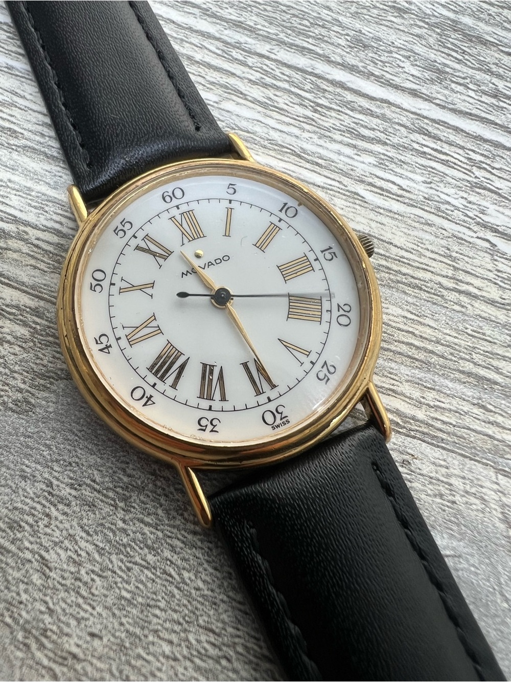 Movado Gold Tone Case White Dial with Black Leather Strap